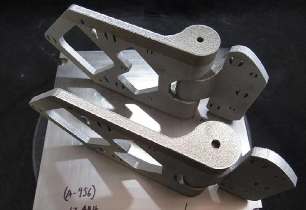Optimized geometry of the additively manufactured hinge, which reduced hinge weight by 38% from the original hinge assembly